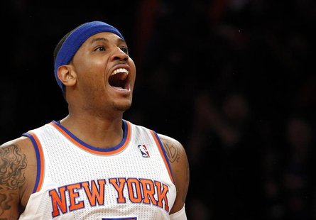 New York Knicks forward Carmelo Anthony reacts after hitting a three-point shot against the Boston Celtics in the first quarter of Game 1 of New York Knicks forward Carmelo Anthony reacts after hitting a three-point shot against the Boston Celtics in the first quarter of Game 1 of