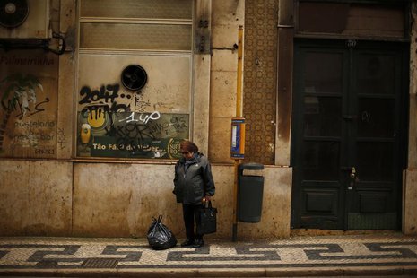 A woman waits for bus in downtown Lisbon April 8, 2013. REUTERS/Rafael Marchante A woman waits for bus in downtown Lisbon April 8, 2013. REUTERS/Rafael Marchante