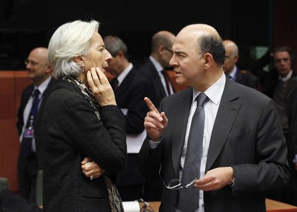 International Monetary Fund (IMF) managing director Christine Lagarde (L) and France's Finance Minister Pierre Moscovici chat at the start o International Monetary Fund (IMF) managing director Christine Lagarde (L) and France's Finance Minister Pierre Moscovici chat at the start o