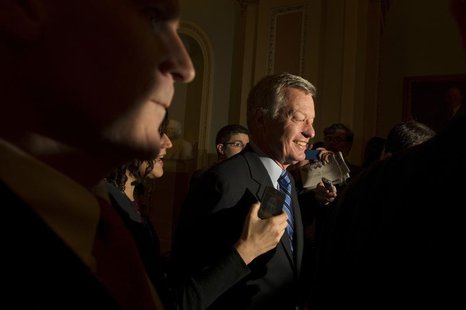 Sen. Max Baucus, (D-MT) is questioned by media at the U.S. Capitol in Washington December 31, 2012. REUTERS/Mary F. Calvert Sen. Max Baucus, (D-MT) is questioned by media at the U.S. Capitol in Washington December 31, 2012. REUTERS/Mary F. Calvert