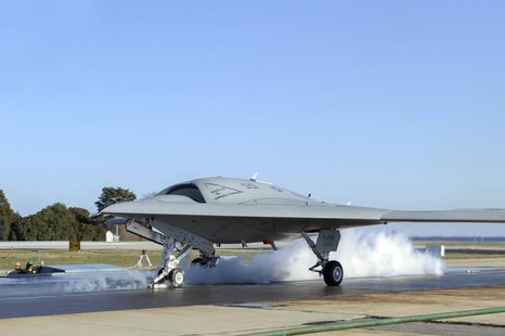 A launch crew prepares a Northrop Grumman X-47B Unmanned Combat Air System (UCAS) demonstrator for its first land-based catapult launch in t A launch crew prepares a Northrop Grumman X-47B Unmanned Combat Air System (UCAS) demonstrator for its first land-based catapult launch in t