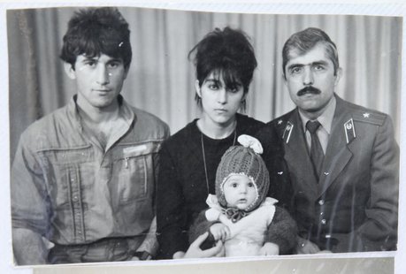 A photo, showing Tamerlan (C, bottom) Tsarnaev, accompanied by his father Anzor (L), mother Zubeidat and uncle Muhamad Suleimanov (R), is se A photo, showing Tamerlan (C, bottom) Tsarnaev, accompanied by his father Anzor (L), mother Zubeidat and uncle Muhamad Suleimanov (R), is se