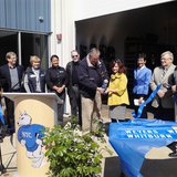 NTC board member Paul Proulx cuts the ribbon on the new Public Safety Center in Merrill