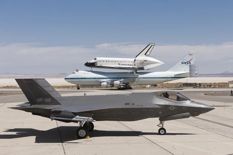A Lockheed Martin F-35 Joint Strike Fighter (JSF) is pictured with the space shuttle Endeavour mounted atop its 747 Shuttle Carrier Aircraft A Lockheed Martin F-35 Joint Strike Fighter (JSF) is pictured with the space shuttle Endeavour mounted atop its 747 Shuttle Carrier Aircraft