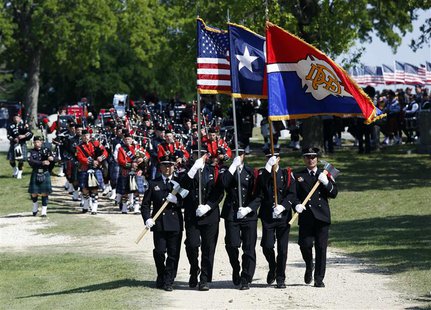 Firefighters carry flags and lead the procession for Dallas Fire-Rescue Captain Kenneth "Luckey" Harris, Jr. during his funeral at the Bold Firefighters carry flags and lead the procession for Dallas Fire-Rescue Captain Kenneth "Luckey" Harris, Jr. during his funeral at the Bold