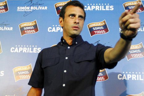Venezuela's opposition leader Henrique Capriles gestures as he arrives at a news conference in Caracas April 18, 2013. REUTERS/Carlos Garcia Venezuela's opposition leader Henrique Capriles gestures as he arrives at a news conference in Caracas April 18, 2013. REUTERS/Carlos Garcia