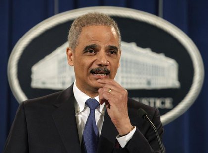 U.S. Attorney General Eric Holder speaks at a news conference to announce a major financial fraud enforcement action at the Justice Departme U.S. Attorney General Eric Holder speaks at a news conference to announce a major financial fraud enforcement action at the Justice Departme