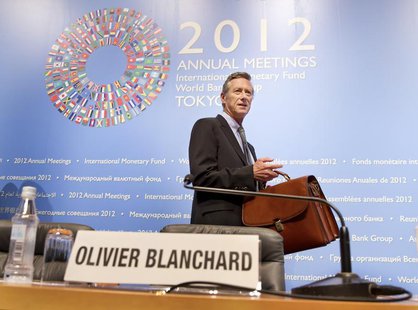 International Monetary Fund's Economic Counsellor and Director of Research Department Olivier Blanchard enters the news briefing on the Worl International Monetary Fund's Economic Counsellor and Director of Research Department Olivier Blanchard enters the news briefing on the Worl