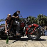 A man and a woman take part in a competition of riding skills in their Harley Davidson motorcycle during Cuba's Second Harley Davidson Conve A man and a woman take part in a competition of riding skills in their Harley Davidson motorcycle during Cuba's Second Harley Davidson Conve