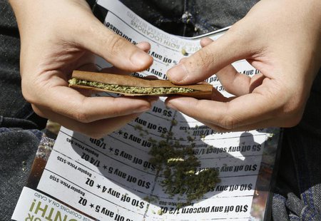A participant rolls a marijuana filled blunt at the 4/20 marijuana holiday in Civic Center Park in downtown Denver April 20, 2013. REUTERS/R A participant rolls a marijuana filled blunt at the 4/20 marijuana holiday in Civic Center Park in downtown Denver April 20, 2013. REUTERS/R