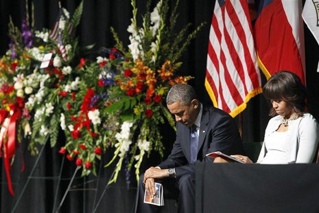 President Barack and Michelle Obama bow their heads during a memorial service for the victims of the fertilizer plant explosion last week, a President Barack and Michelle Obama bow their heads during a memorial service for the victims of the fertilizer plant explosion last week, a