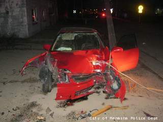 Vehicle damaged by street racing crash in Menasha on April 24, 2013. (courtesy of the City of Menasha Police Department). Vehicle damaged by street racing crash in Menasha on April 24, 2013. (courtesy of the City of Menasha Police Department).