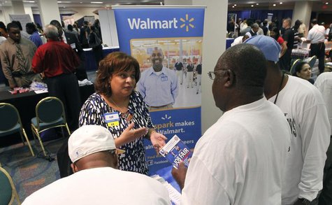 Job candidates receive information about employment at Walmart at a U.S. Congressional Black Caucus Jobs Fair in Miami, Florida August 23, 2 Job candidates receive information about employment at Walmart at a U.S. Congressional Black Caucus Jobs Fair in Miami, Florida August 23, 2