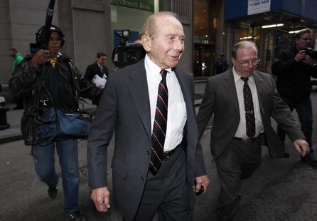 Former CEO of American International Group Inc., Maurice "Hank" Greenberg, (C) leaves a building in downtown New York after being deposed by Former CEO of American International Group Inc., Maurice "Hank" Greenberg, (C) leaves a building in downtown New York after being deposed by