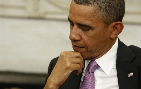 U.S. President Barack Obama listens to Qatar Emir Sheikh Hamad bin Khalifa al-Thaniat (not pictured) at the Oval Office of the White House i U.S. President Barack Obama listens to Qatar Emir Sheikh Hamad bin Khalifa al-Thaniat (not pictured) at the Oval Office of the White House i