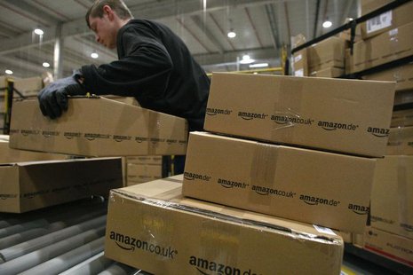 A worker carries packages for shipment at the Amazon warehouse in Leipzig, December 3, 2008. REUTERS/Fabrizio Bensch A worker carries packages for shipment at the Amazon warehouse in Leipzig, December 3, 2008. REUTERS/Fabrizio Bensch