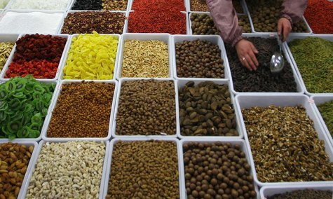 A vendor sells dry fruits and nuts at a market in Lanzhou, northwest China's Gansu province, March 14, 2007. REUTERS/Stringer A vendor sells dry fruits and nuts at a market in Lanzhou, northwest China's Gansu province, March 14, 2007. REUTERS/Stringer