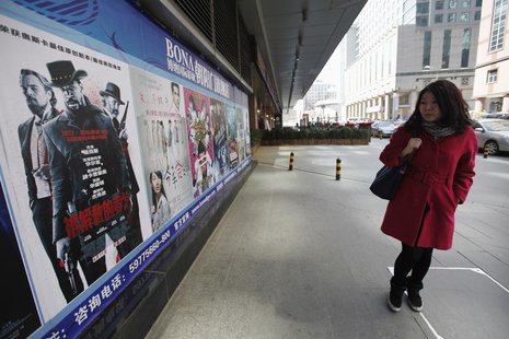 A woman looks at a poster of the film "Django Unchained" outside a cinema in Beijing, April 11, 2013. REUTERS/Jason Lee A woman looks at a poster of the film "Django Unchained" outside a cinema in Beijing, April 11, 2013. REUTERS/Jason Lee