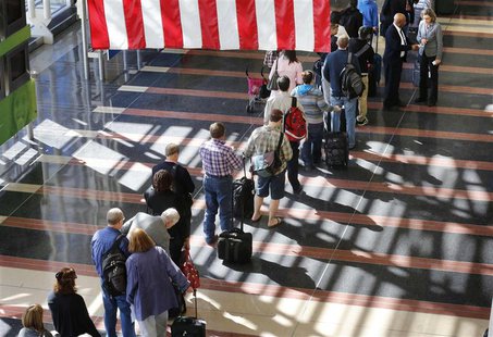 A long line of passengers wait to enter the security checkpoint before boarding their aircraft at Reagan National Airport in Washington, Apr A long line of passengers wait to enter the security checkpoint before boarding their aircraft at Reagan National Airport in Washington, Apr