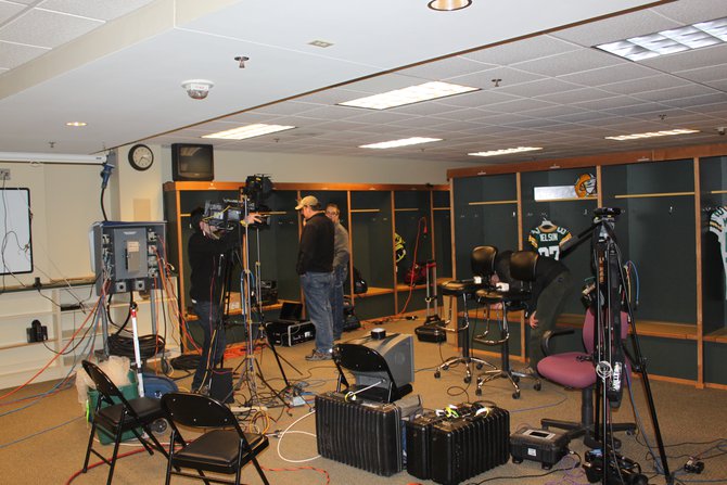 TV stations set up in the visiting team locker room