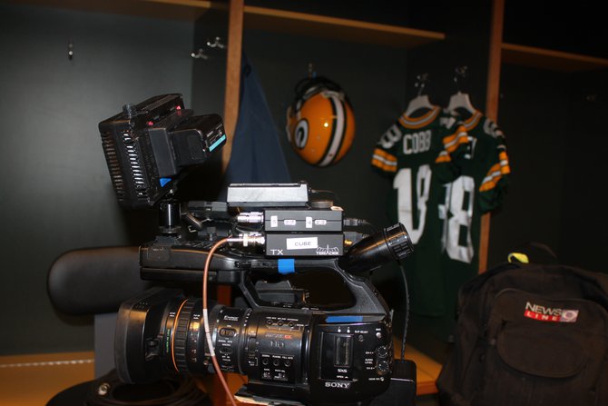 TV stations set up in the visiting team locker room