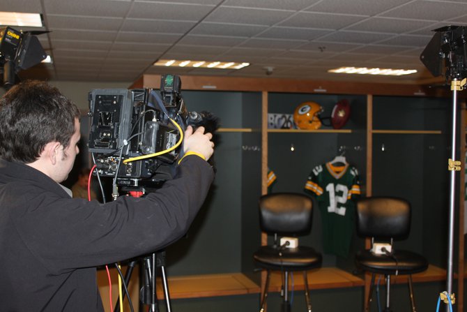 TV stations set up in the visiting team locker room