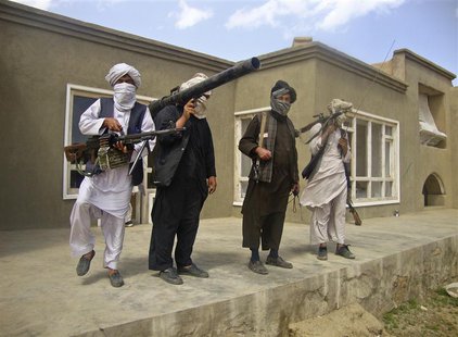 Taliban fighters pose with weapons at an undisclosed location in southern Afghanistan in this May 5, 2011 picture. REUTERS/Stringer Taliban fighters pose with weapons at an undisclosed location in southern Afghanistan in this May 5, 2011 picture. REUTERS/Stringer