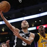 San Antonio Spurs Tony Parker (L) is fouled by Los Angeles Lakers Dwight Howard as he goes up to shoot during Game 3 of their NBA Western Co