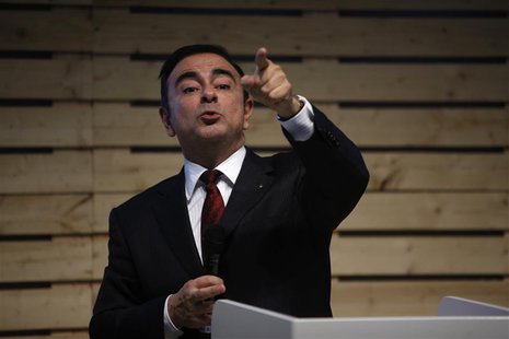 Carlos Ghosn, chairman and chief executive officer of French carmaker Renault, speaks with journalists during a meeting to promote the new e Carlos Ghosn, chairman and chief executive officer of French carmaker Renault, speaks with journalists during a meeting to promote the new e