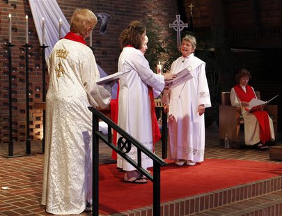 Rosemarie Smead (2nd R), a 70-year-old Kentucky woman, is ordained a Roman Catholic priest during a Celebration of Ordination at St. Andrew' Rosemarie Smead (2nd R), a 70-year-old Kentucky woman, is ordained a Roman Catholic priest during a Celebration of Ordination at St. Andrew'