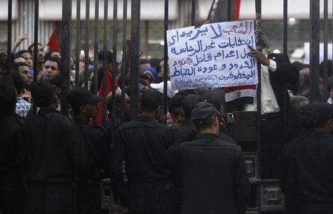 Egyptians shout slogans against Egyptian President Mohamed Mursi and members of the Brotherhood in front of the High Judicial Court during a Egyptians shout slogans against Egyptian President Mohamed Mursi and members of the Brotherhood in front of the High Judicial Court during a