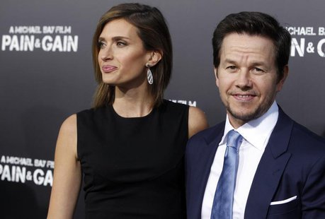 Actor Mark Wahlberg and his wife Rhea Durham arrive at the premiere of his new film "Pain & Gain" in Hollywood April 22, 2013. REUTERS/Fred Actor Mark Wahlberg and his wife Rhea Durham arrive at the premiere of his new film "Pain & Gain" in Hollywood April 22, 2013. REUTERS/Fred