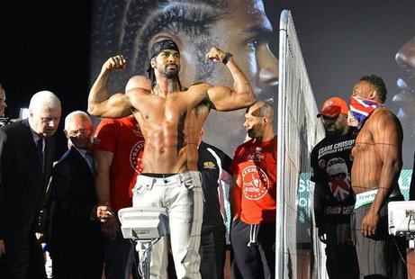 Former WBA world heavyweight champion David Haye (C) poses during his weigh-in as former British & Commonwealth heavyweight champion Dereck Former WBA world heavyweight champion David Haye (C) poses during his weigh-in as former British & Commonwealth heavyweight champion Dereck