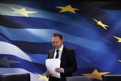 Greece's Finance Minister Yannis Stournaras arrives for a news conference at a ministry hall in Athens April 16, 2013. REUTERS/Yorgos Karaha Greece's Finance Minister Yannis Stournaras arrives for a news conference at a ministry hall in Athens April 16, 2013. REUTERS/Yorgos Karaha