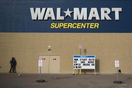 A man stands on a skateboard outside a Wal-Mart store in Williston, North Dakota March 13, 2013. REUTERS/Shannon Stapleton A man stands on a skateboard outside a Wal-Mart store in Williston, North Dakota March 13, 2013. REUTERS/Shannon Stapleton