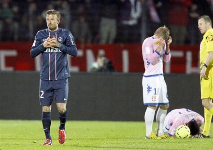 David Beckham (L) of Paris St-Germain gestures after receiving a red card during their French Ligue 1 soccer match against Evian Thonon Gail David Beckham (L) of Paris St-Germain gestures after receiving a red card during their French Ligue 1 soccer match against Evian Thonon Gail