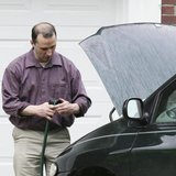 Everett Dutschke works on his mini-van in his driveway in Tupelo Mississippi on April 26, 2013. Federal agents arrested Dutschke on Saturday