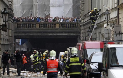 Firefighters search the area after an explosion in Prague April 29, 2013. The explosion in central Prague on Monday injured about a dozen pe Firefighters search the area after an explosion in Prague April 29, 2013. The explosion in central Prague on Monday injured about a dozen pe