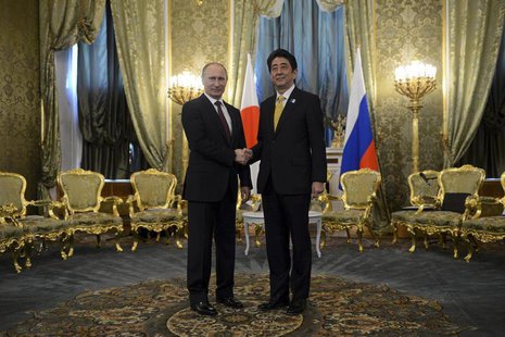 Russia's President Vladimir Putin (L) shakes hands with Japan's Prime Minister Shinzo Abe during a meeting at the Kremlin in Moscow April 29 Russia's President Vladimir Putin (L) shakes hands with Japan's Prime Minister Shinzo Abe during a meeting at the Kremlin in Moscow April 29