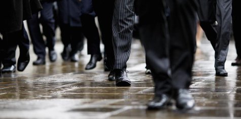 Commuters walk in to London's financial district during the morning rush hour October 7, 2008. REUTERS/Stephen Hird Commuters walk in to London's financial district during the morning rush hour October 7, 2008. REUTERS/Stephen Hird
