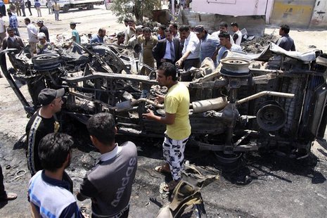 Residents gather at the site of a car bomb attack in Kerbala, 110 km (70 miles) south of Baghdad, April 29, 2013. REUTERS/Mushtaq Muhammed Residents gather at the site of a car bomb attack in Kerbala, 110 km (70 miles) south of Baghdad, April 29, 2013. REUTERS/Mushtaq Muhammed