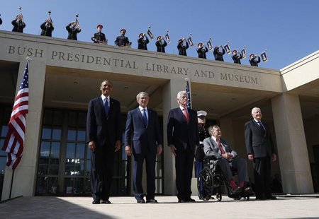 U.S. President Barack Obama (L) stands alongside (L-R) former presidents George W. Bush, Bill Clinton, George H.W. Bush and Jimmy Carter as U.S. President Barack Obama (L) stands alongside (L-R) former presidents George W. Bush, Bill Clinton, George H.W. Bush and Jimmy Carter as