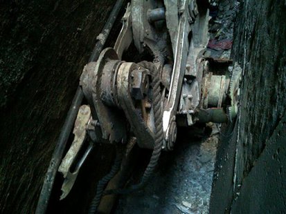A part of the landing gear, apparently from one of the commercial airliners destroyed on September 11, 2001, is seen wedged between two buil A part of the landing gear, apparently from one of the commercial airliners destroyed on September 11, 2001, is seen wedged between two buil
