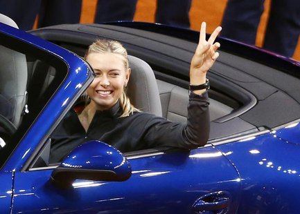 Russia's top seed and holder Maria Sharapova celebrates after she won a Porsche 911 4S in the final of the Stuttgart tennis Grand Prix again Russia's top seed and holder Maria Sharapova celebrates after she won a Porsche 911 4S in the final of the Stuttgart tennis Grand Prix again