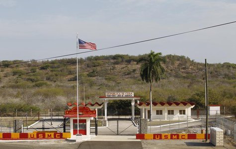 The Northeast gate marks the end of U.S. soil as the road leads into Cuba at Guantanamo Bay U.S. Naval Base, March 8, 2013. REUTERS/Bob Stro The Northeast gate marks the end of U.S. soil as the road leads into Cuba at Guantanamo Bay U.S. Naval Base, March 8, 2013. REUTERS/Bob Stro