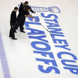 Crews prepare the ice for the start of the Stanley Cup Playoffs following the NHL hockey game between the Boston Bruins and the Ottawa Senat