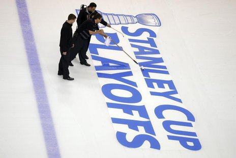 Crews prepare the ice for the start of the Stanley Cup Playoffs following the NHL hockey game between the Boston Bruins and the Ottawa Senat Crews prepare the ice for the start of the Stanley Cup Playoffs following the NHL hockey game between the Boston Bruins and the Ottawa Senat