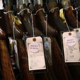 A row of shotguns are seen during the East Coast Fine Arms Show in Stamford, Connecticut, January 5, 2013. REUTERS/Carlo Allegri