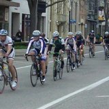 Cyclists sprint along 8th Street in downtown Holland during the first Queen's Criterium race on Apr. 28, 2013.