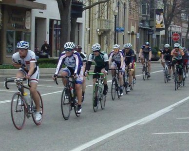 Cyclists sprint along 8th Street in downtown Holland during the first Queen's Criterium race on Apr. 28, 2013. Cyclists sprint along 8th Street in downtown Holland during the first Queen's Criterium race on Apr. 28, 2013.